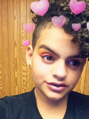 Mya in 2017 with a colorful glam look